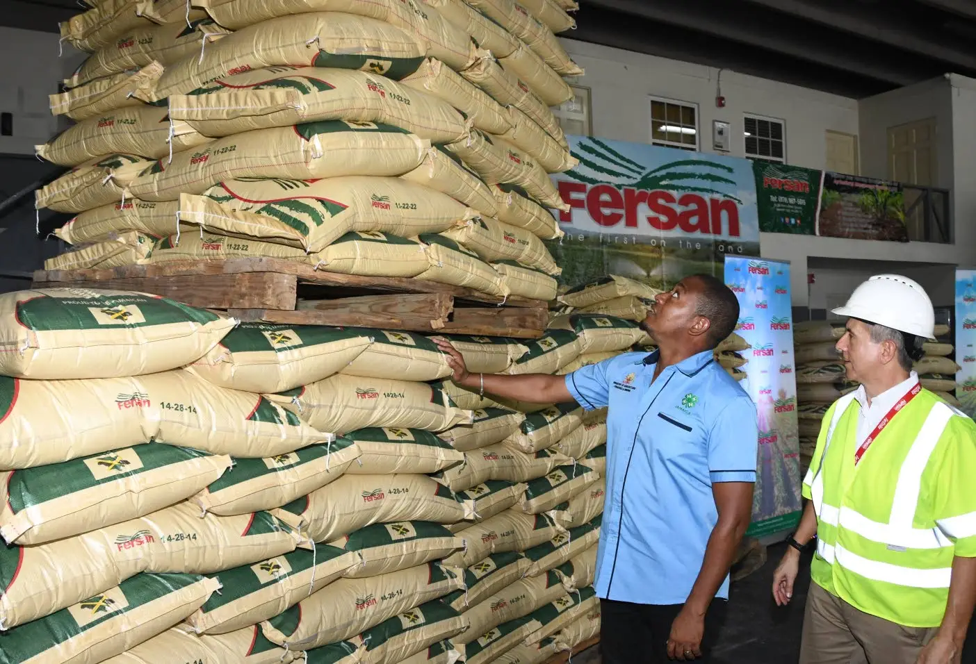 Minister of Agriculture Floyd Green (left) and managing director at Newport-Fersan Dennis Valdez at the hand over ceremony on Tuesday at Newport Fersan Jamaica Limited. Joseph Wellington