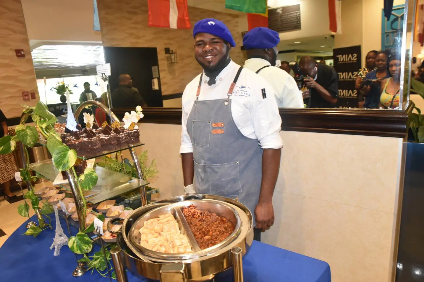 Line chef Deshawn “Big Pop” Miller mans the stand.Courtesy of Jamaica Pegasus