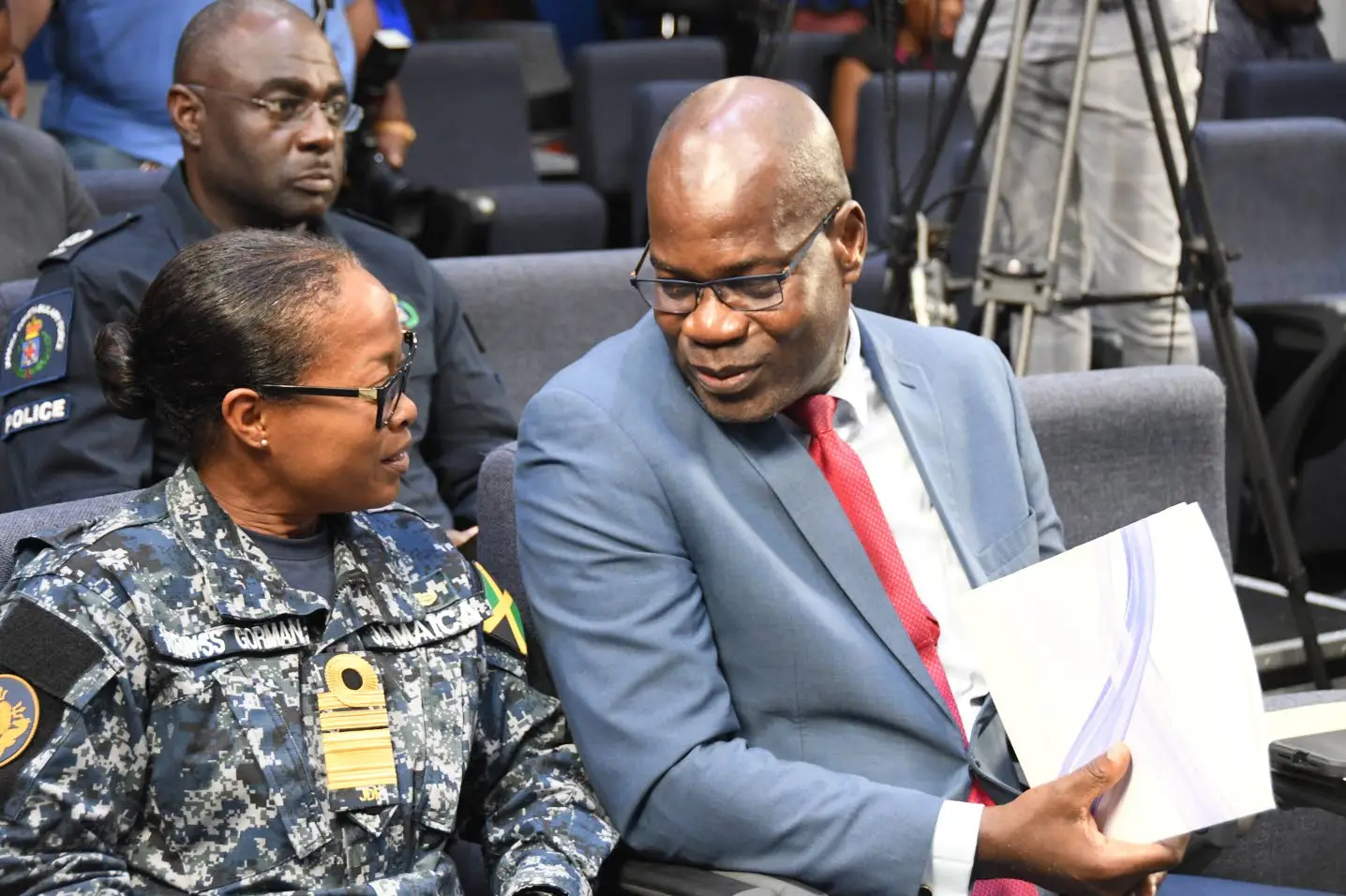 Head of Jamaica Constabulary’s crime and security portfolio, Deputy Commissioner of Police Fitz Bailey and chief of defence staff of Jamaica Defence Force, Vice-Admiral Antonette Wemyss Gorman, in conversation before Monday’s emergency press briefing at Jamaica House in St Andrew.