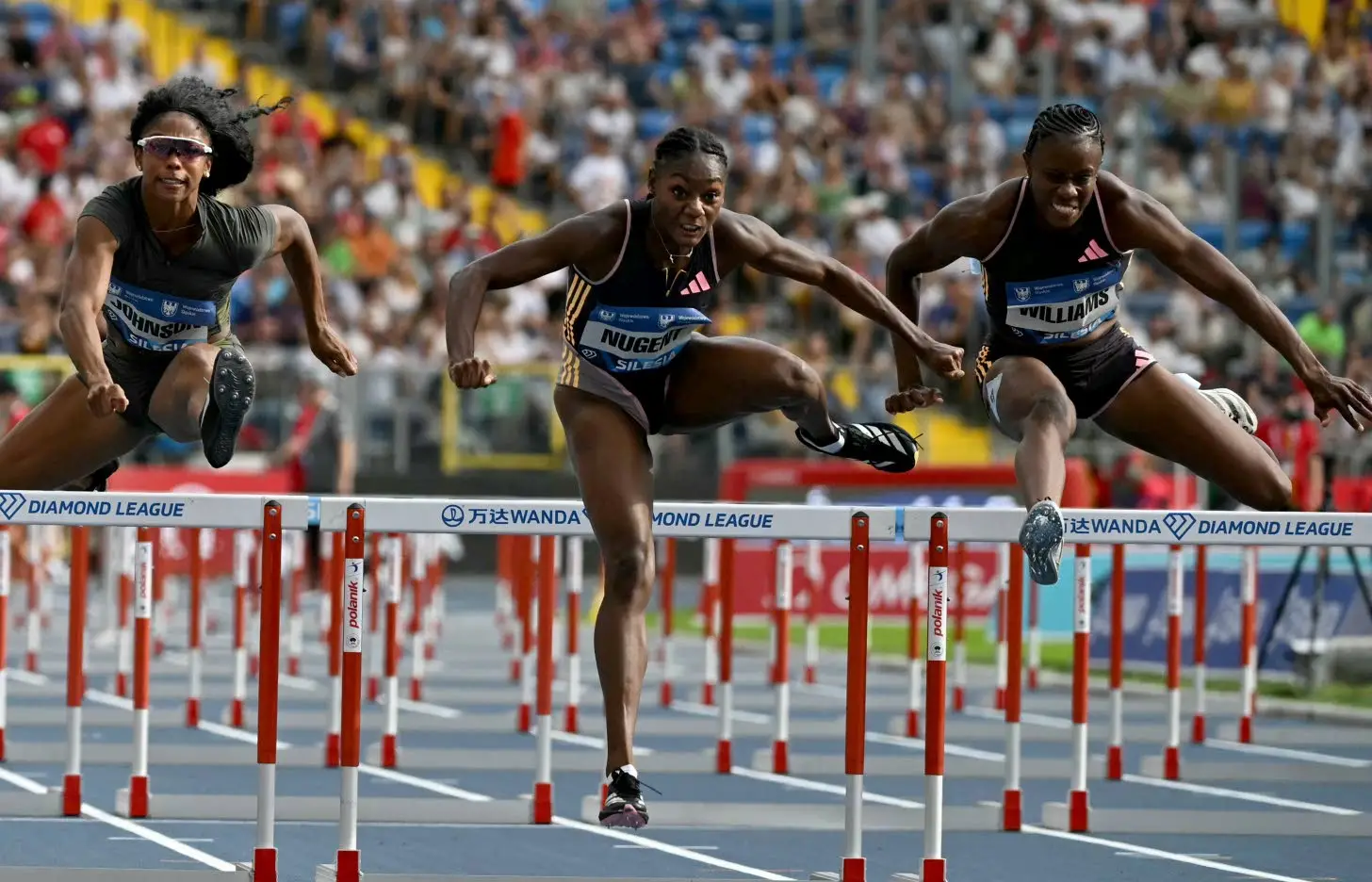 From left: Alaysha Johnson of the United States and the Jamaican pair of Ackera Nugent and Danielle Williams compete in the Women’s 100m hurdles event during the Silesia Diamond League athletics meeting in Chorzow, Poland, on Sunday. Nugent won in a meet record 12.29 seconds.Photo: AFP