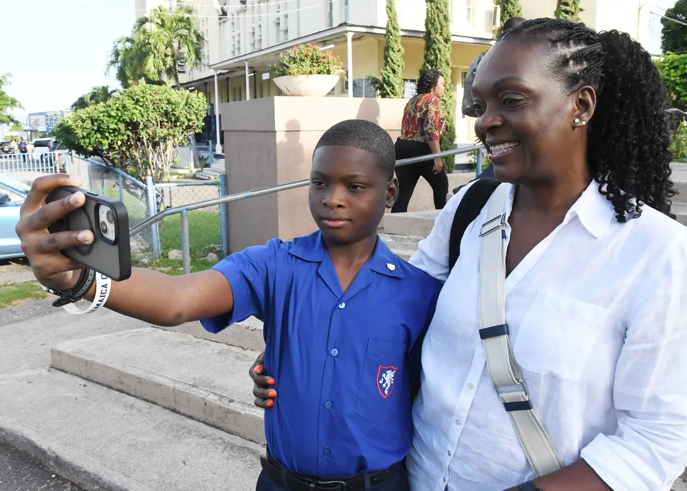 Malia Gibbs, a first-form student of Jamaica College takes a selfie with his mother Andrea Muir-Gibbs on the school grounds during Monday’s start of the new academic year.