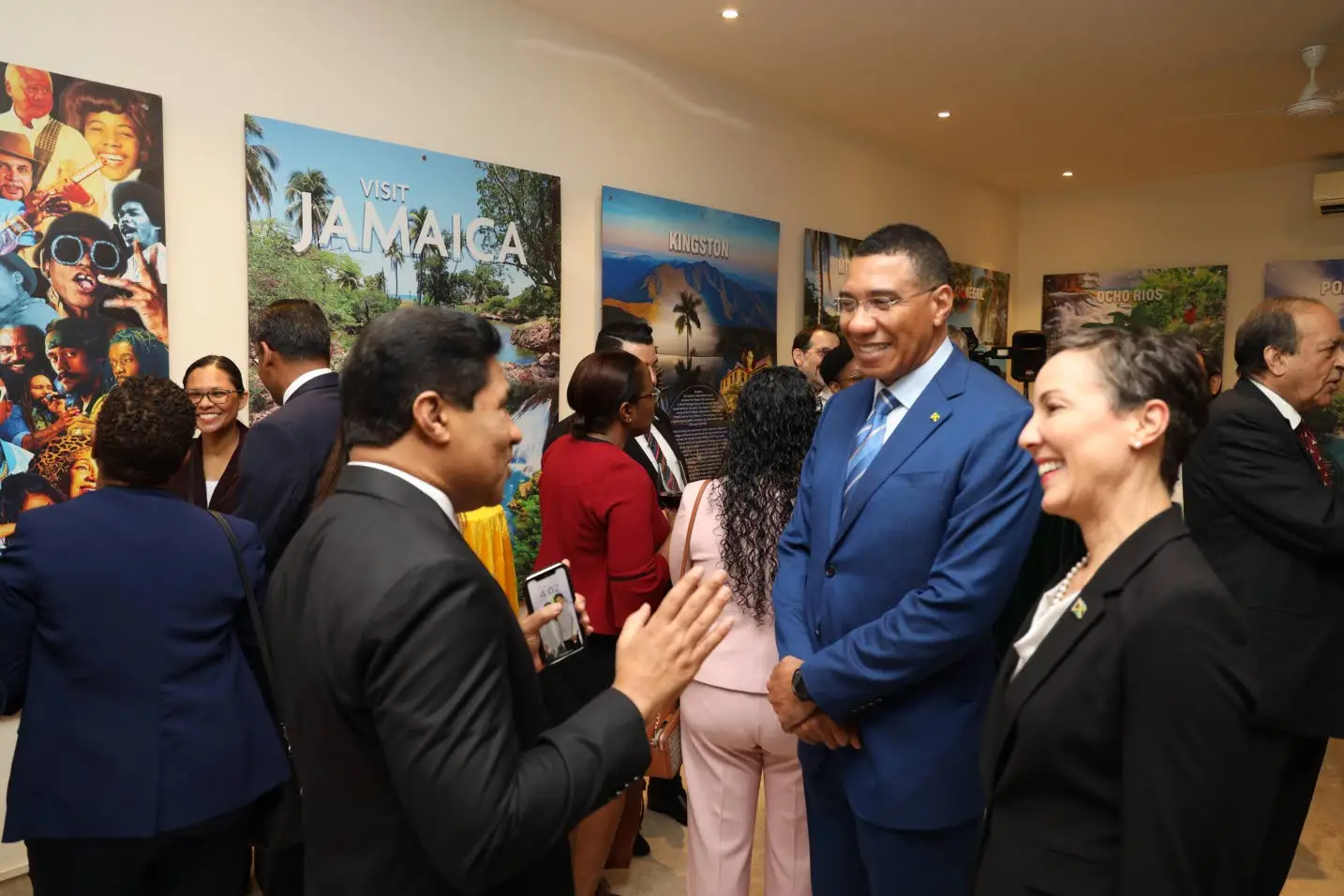 Jamaica’s Prime Minister Andrew Holness (second right) and Foreign Affairs and Foreign Trade Minister Senator Kamina Johnson Smith enjoying a discussion with an Indian official at a reception in New Delhi on Monday, the first day of Holness’s four-day bilateral visit to India.