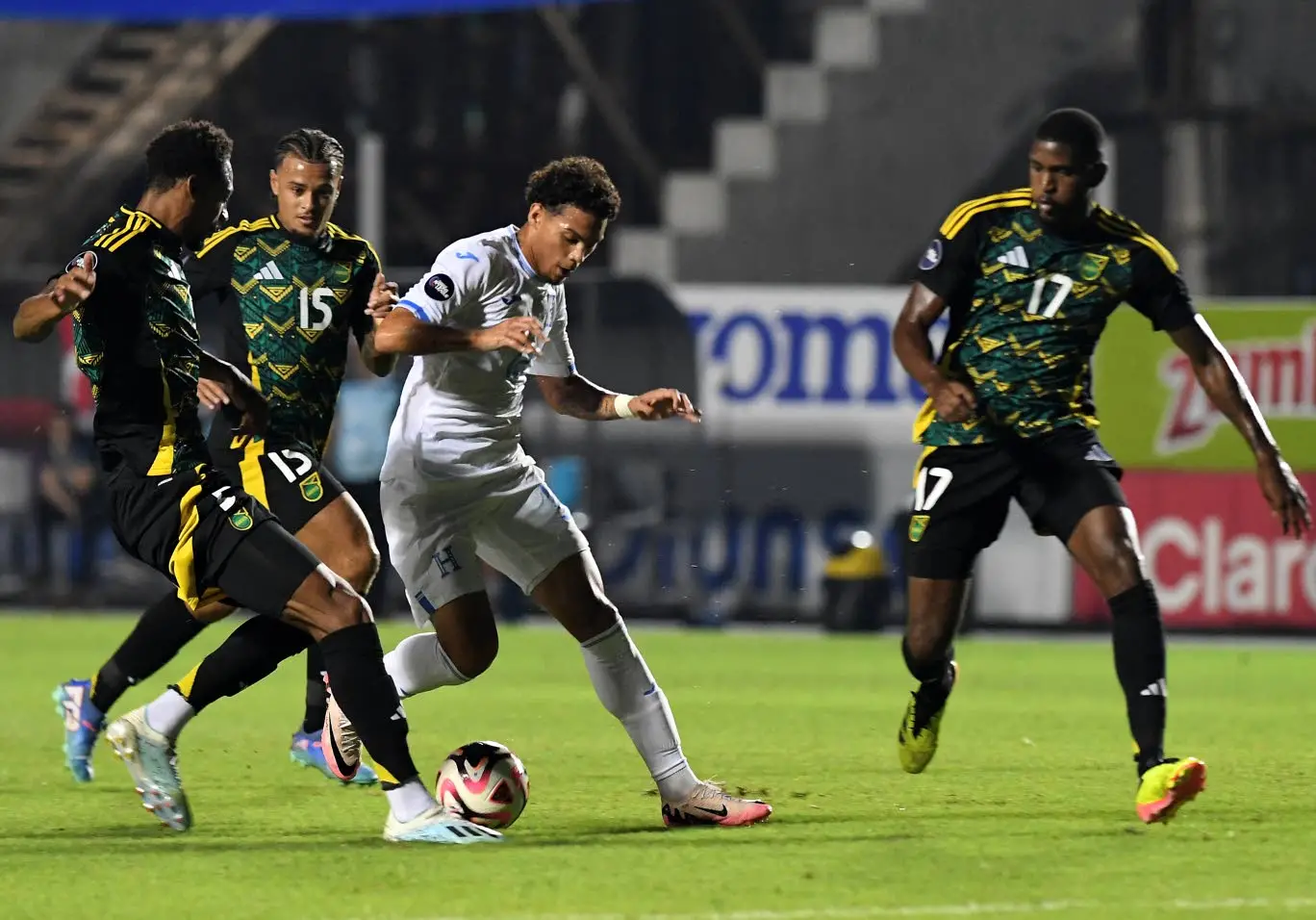 David Ruiz (second right) of Honduras, Jamaica’s Ethan Pinnock (left) and Jamaica’s Joel Latibeaudiere (second left) fight for the ball next to Jamaica’s Damion Lowe during their Concacaf Nations League group stage football match at the National stadium in Tegucigalpa, Honduras, on Tuesday.AFP