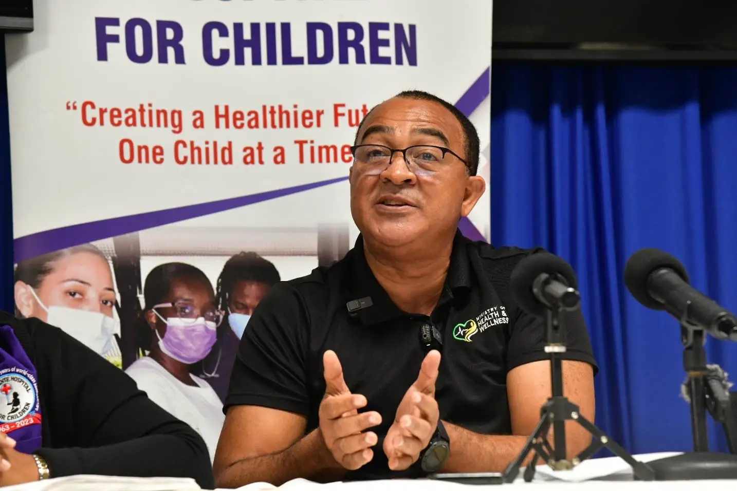 Minister of Health and Wellness, Dr Christopher Tufton addressing journalists during a media briefing at Bustamante Hospital for Children on Thursday. He gave an update on arrangeements made for an 11-year-old girl ailing from scoliosis to get corrective surgery.Photo: JIS