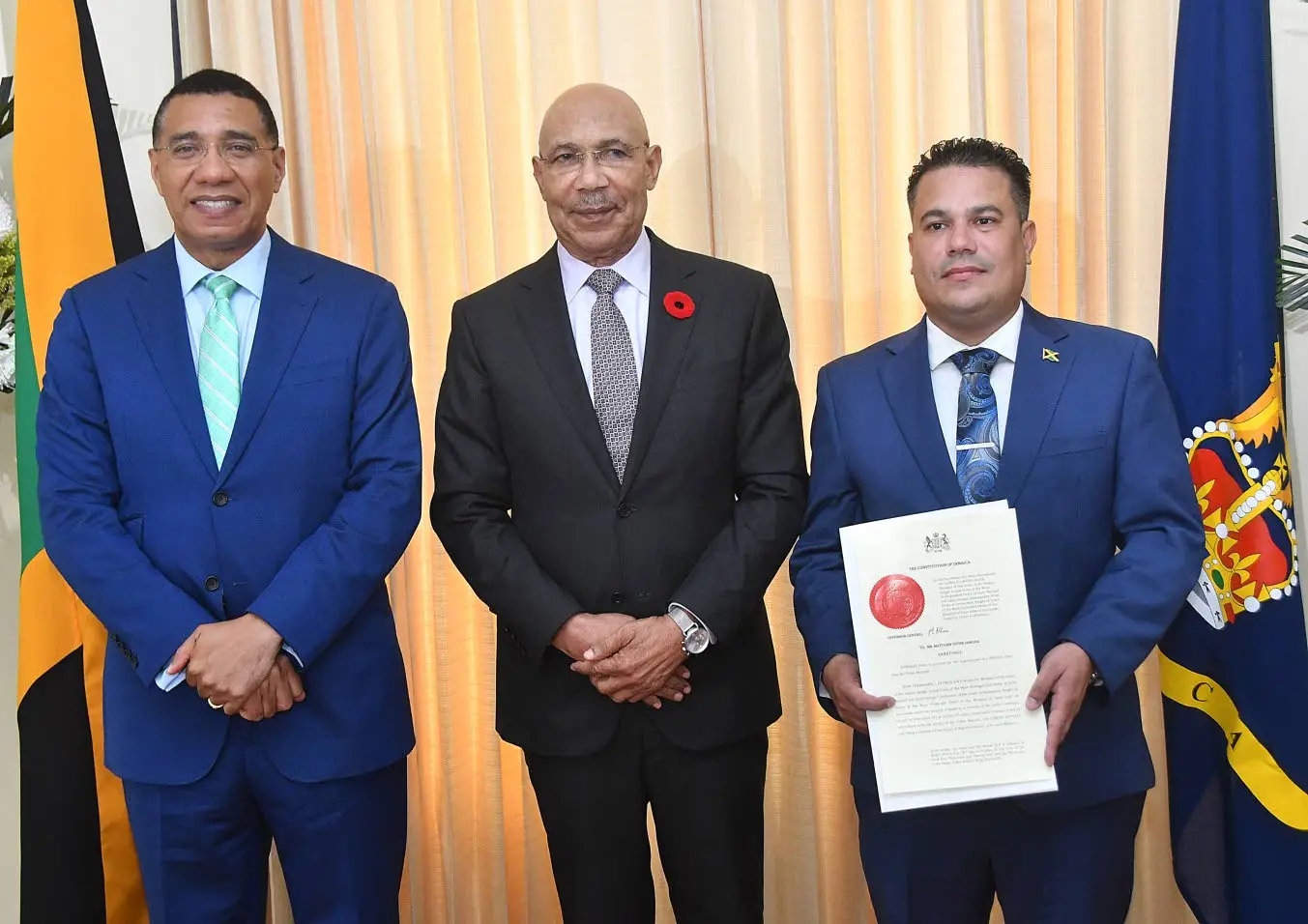 Governor General Sir Patrick (centre), Prime Minister Dr Andrew Holness (left) and newly appointed minister without portfolio in the Ministry of Economic Growth and Job Creation Matthew Samuda pose for a photo.