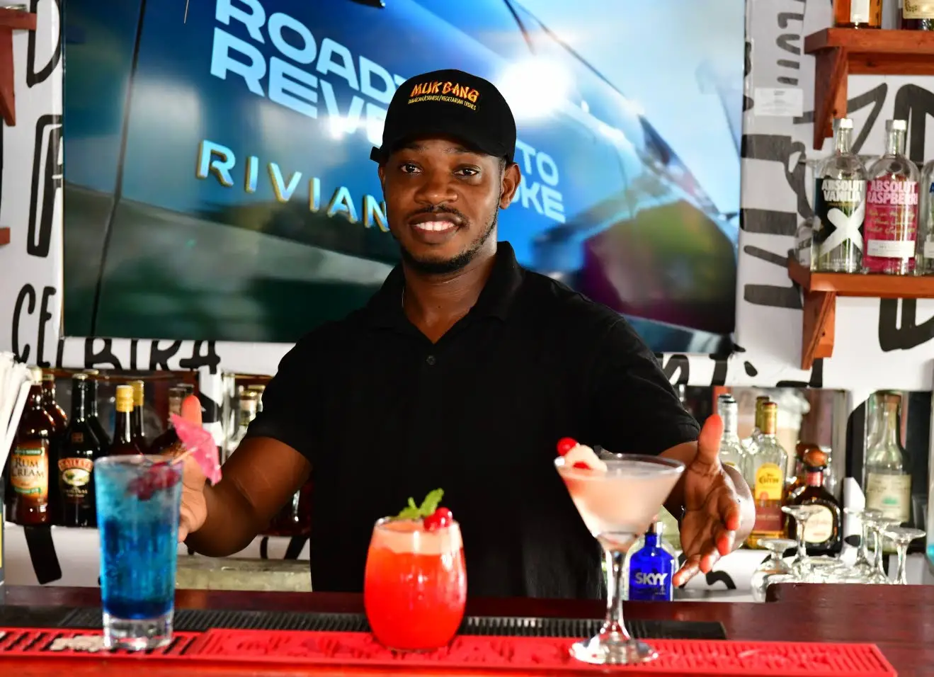 Traize Robinson, mixologist, serves up cocktails at the bar.Aceion Cunningham