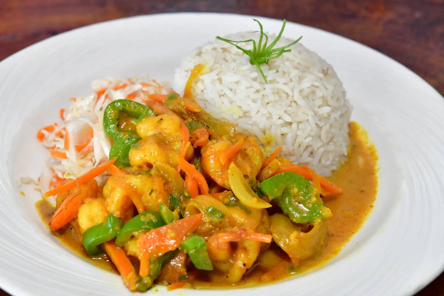 Curried shrimp served with rice and vegetablesAceion Cunningham