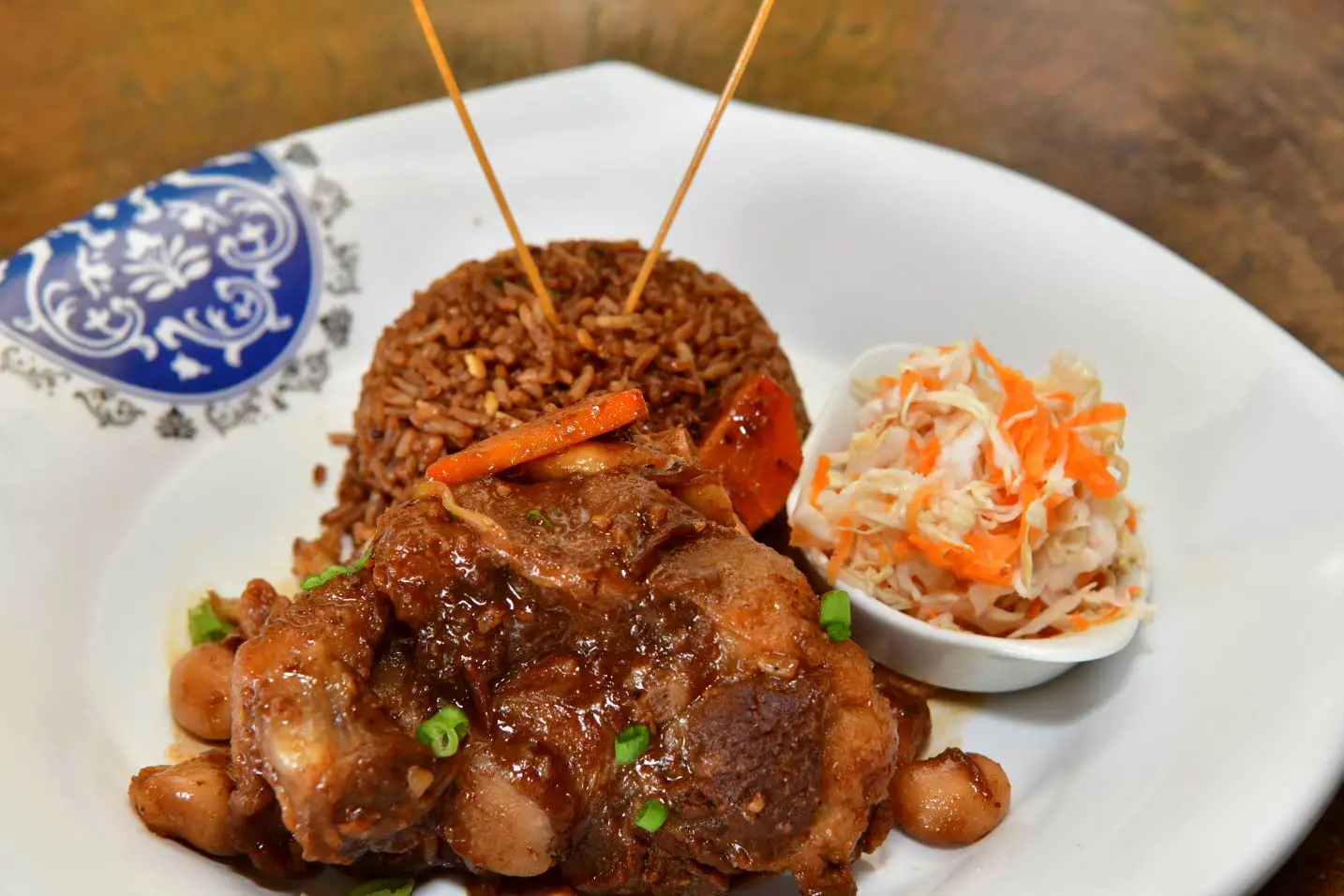 Braised oxtail with fried rice and vegetablesAceion Cunningham