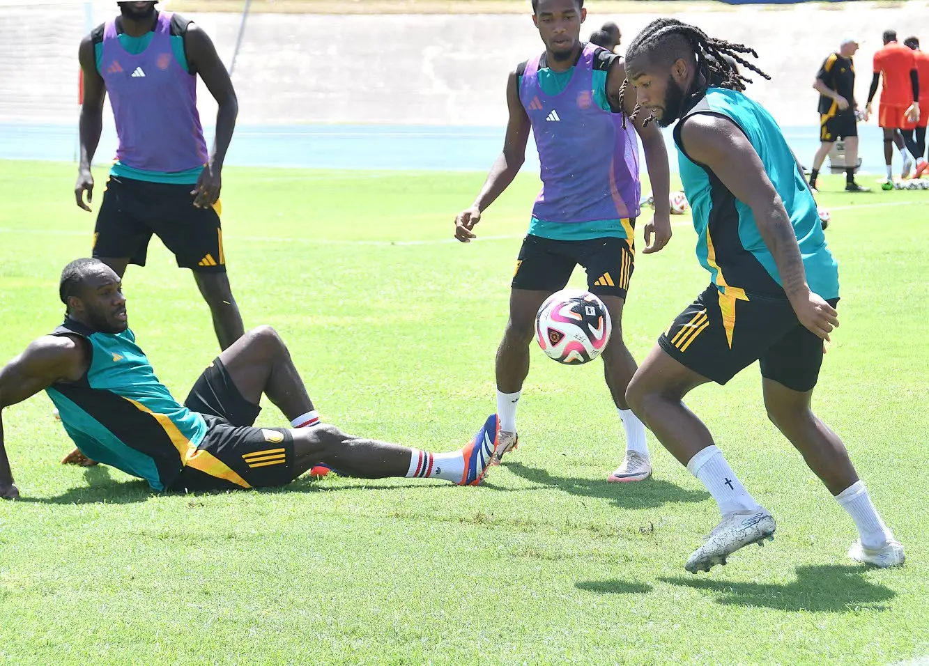 Reggae Boyz Forward Michail Antonio (left) watches as midfielder Kasey Palmer (right) dribbles away during the Reggae Boyz’s training session at the National Stadium on September 5, 2024. garfield Robinson