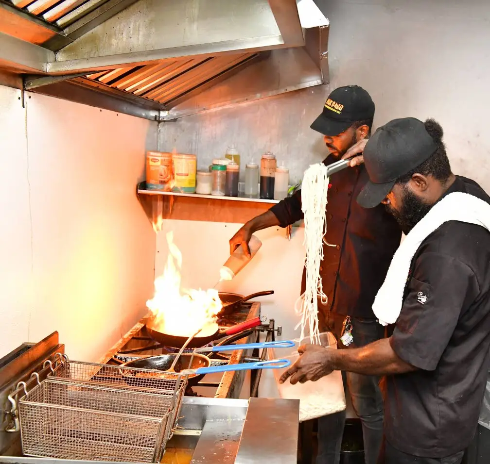 Muk Bang chefs prepping noodles and sweet and sour chicken.Aceion Cunningham