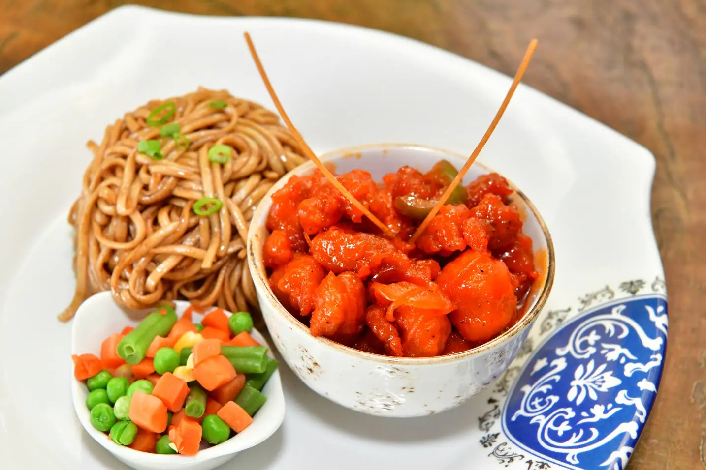 Sweet and sour chicken with noodles and vegetablesAceion Cunningham