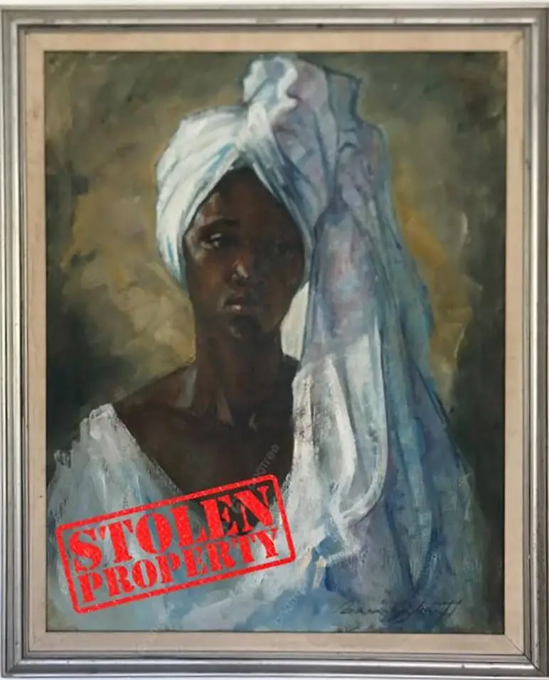 A photo of one of the stolen paintings which the family members have stamped.