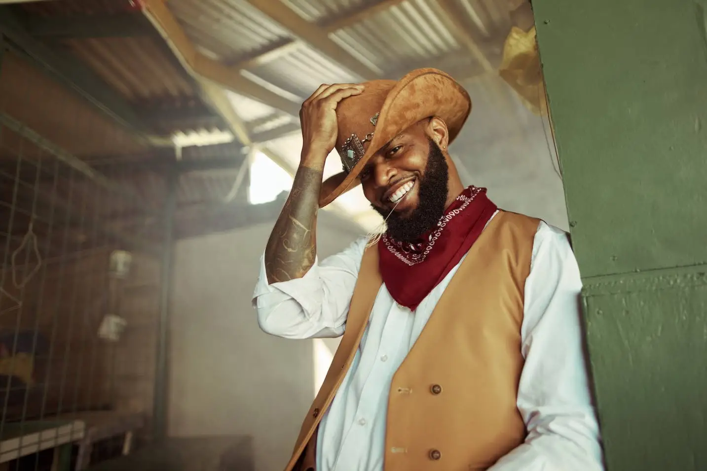 Tafari Forbes is the classic cowboy in a tan cowboy hat, white buttoned-down shirt, tan vest and paisley bandanna.WILL TWORT