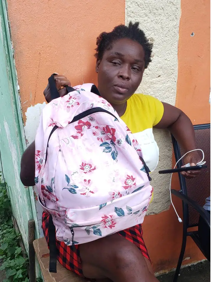 Latoya Lodge with her late daughter Jody-Ann’s bloodied school bag.