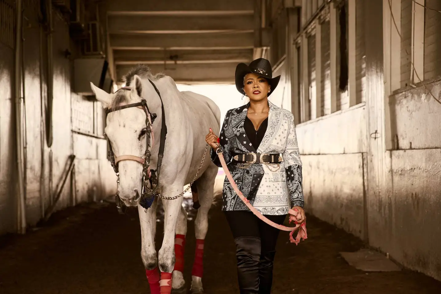 Wild West-ready! Media personality Debbie Bissoon shows off a black & white jacket, belt and hat.WILL TWORT